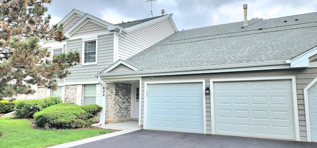 602 Berkley Ct Unit 2Z, Schaumburg, IL 60194 - townhome / multi-family property featuring asphalt driveway, a shingled roof, and an attached garage