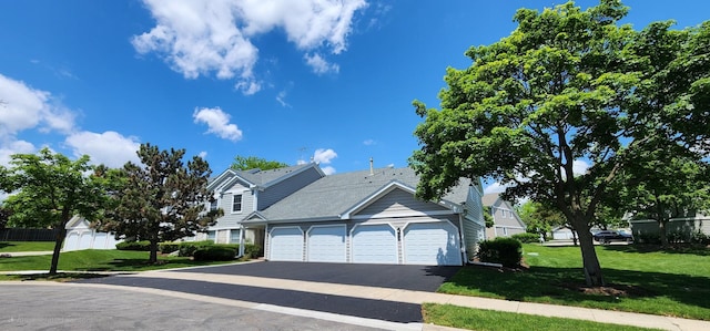 602 Berkley Ct Unit 2Z, Schaumburg, IL 60194 - view of front of property featuring driveway, a garage, and a front yard