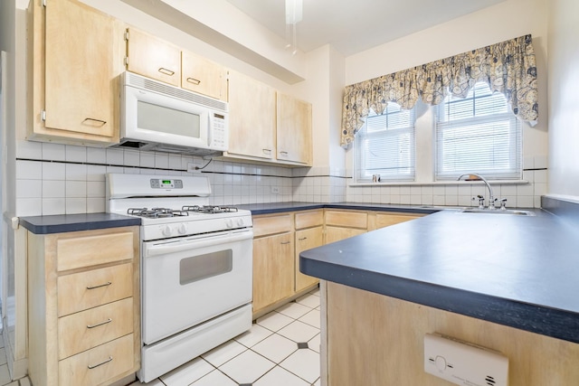 5000 S Cornell Ave Unit 3A, Chicago, IL 60615 - kitchen featuring white appliances, light brown cabinets, dark countertops, and decorative backsplash