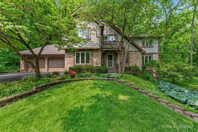 5N538 Hidden Springs Dr, Saint Charles, IL 60175 - view of front of property featuring asphalt driveway, a garage, a front yard, and brick siding