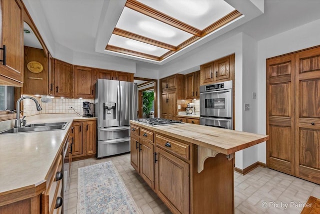 5N538 Hidden Springs Dr, Saint Charles, IL 60175 - kitchen with stainless steel appliances, wood counters, tasteful backsplash, and brown cabinetry
