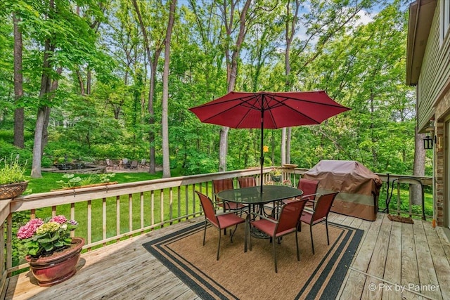 5N538 Hidden Springs Dr, Saint Charles, IL 60175 - wooden deck featuring outdoor dining area, a yard, and view of scattered trees
