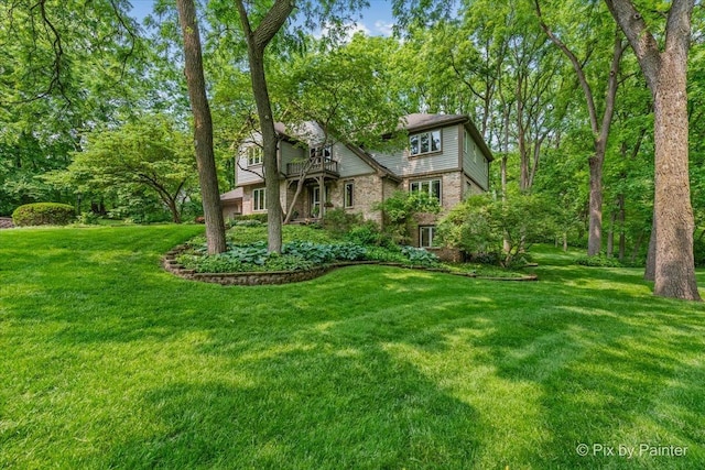 5N538 Hidden Springs Dr, Saint Charles, IL 60175 - view of front of property with brick siding, a front yard, and a balcony