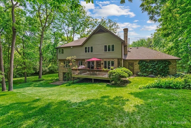 5N538 Hidden Springs Dr, Saint Charles, IL 60175 - back of house with a chimney, a deck, a yard, and brick siding
