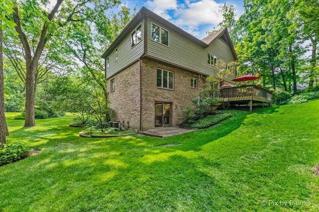 5N538 Hidden Springs Dr, Saint Charles, IL 60175 - back of property featuring brick siding, a deck, and a yard