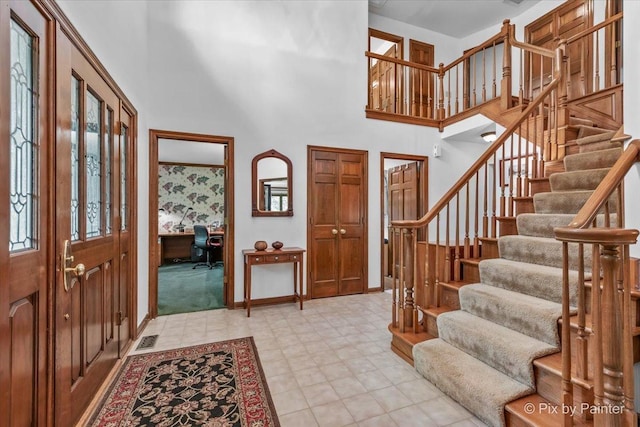 5N538 Hidden Springs Dr, Saint Charles, IL 60175 - entrance foyer with a towering ceiling, stairway, and light flooring