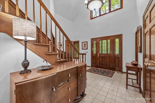 5N538 Hidden Springs Dr, Saint Charles, IL 60175 - entrance foyer with healthy amount of natural light, stairs, a towering ceiling, and light tile patterned floors