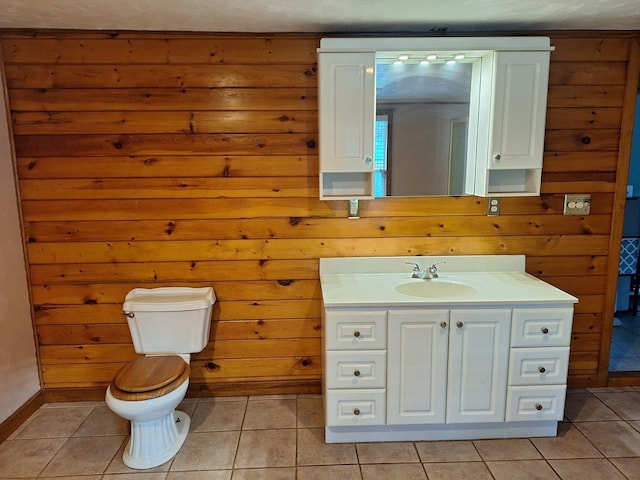 306 N Joy St, Tampico, IL 61283 - bathroom with vanity, toilet, tile patterned floors, and baseboards