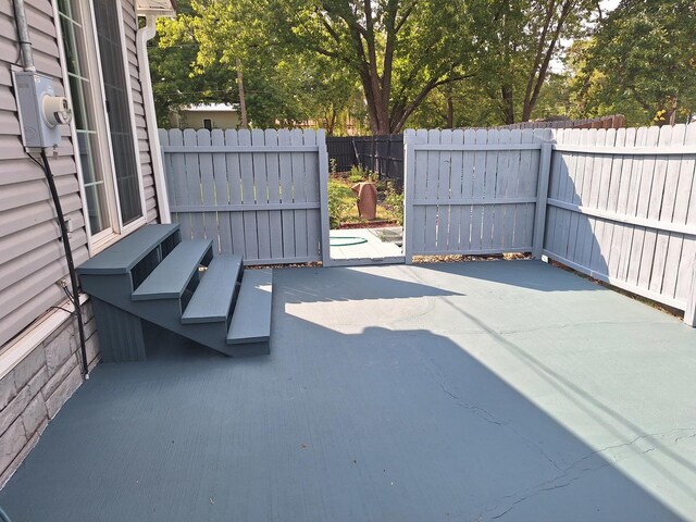 306 N Joy St, Tampico, IL 61283 - fenced backyard with a patio area
