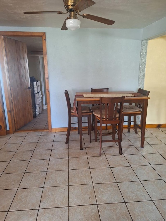 306 N Joy St, Tampico, IL 61283 - dining space with light tile patterned floors, a ceiling fan, and baseboards