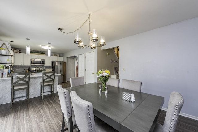 1851 Salem Ct, Gurnee, IL 60031 - dining area featuring a chandelier and dark wood-style flooring