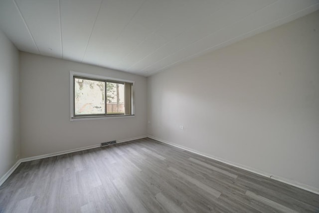 127 N Wolf Rd Unit 63A, Wheeling, IL 60090 - spare room featuring dark wood-style flooring and baseboards