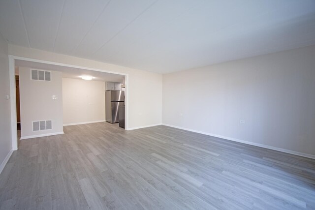 127 N Wolf Rd Unit 63A, Wheeling, IL 60090 - empty room featuring wood finished floors and baseboards