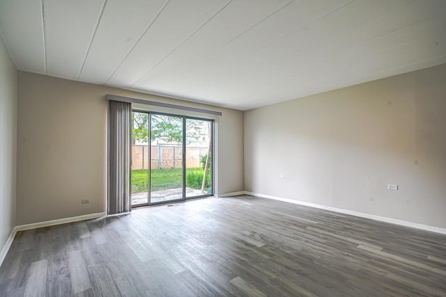 127 N Wolf Rd Unit 63A, Wheeling, IL 60090 - empty room with dark wood-style floors and baseboards
