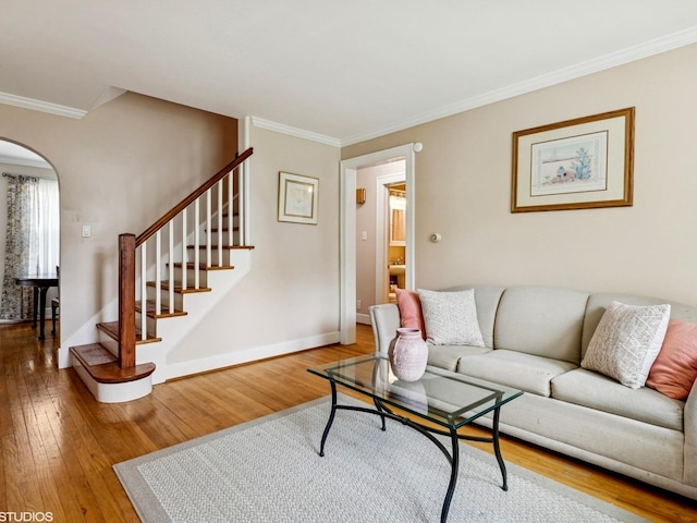 9907 Kedvale Ave, Skokie, IL 60076 - living area with arched walkways, ornamental molding, wood finished floors, and stairway