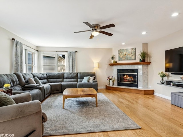 9907 Kedvale Ave, Skokie, IL 60076 - living area with ceiling fan, wood finished floors, a fireplace, and recessed lighting