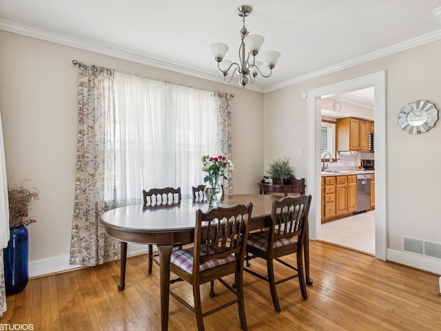 9907 Kedvale Ave, Skokie, IL 60076 - dining room with a chandelier, ornamental molding, and light wood-style flooring