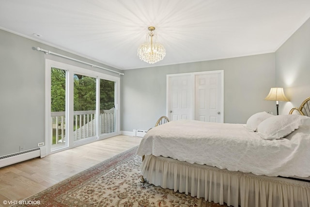 216 Eastern Ave, Barrington, IL 60010 - bedroom featuring access to exterior, ornamental molding, wood finished floors, a chandelier, and a baseboard heating unit