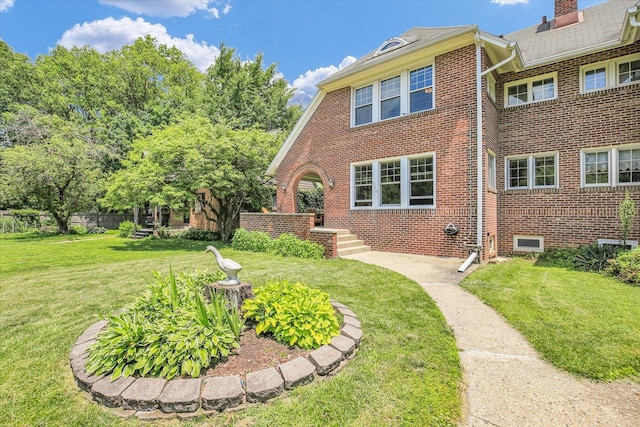 310 Davidson Dr, Champaign, IL 61821 - view of front of home featuring brick siding and a front lawn