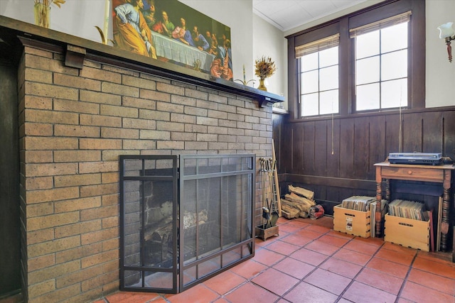 310 Davidson Dr, Champaign, IL 61821 - detailed view of a wainscoted wall, a fireplace, crown molding, and wood walls