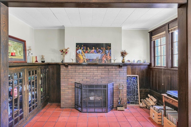 310 Davidson Dr, Champaign, IL 61821 - living room featuring ornamental molding, tile patterned floors, a fireplace, a wainscoted wall, and wooden walls