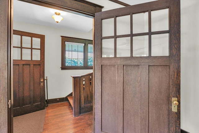 310 Davidson Dr, Champaign, IL 61821 - foyer entrance with dark wood-style floors and baseboards
