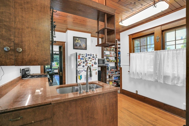310 Davidson Dr, Champaign, IL 61821 - kitchen with wooden ceiling, freestanding refrigerator, stainless steel microwave, wood finished floors, and stone counters
