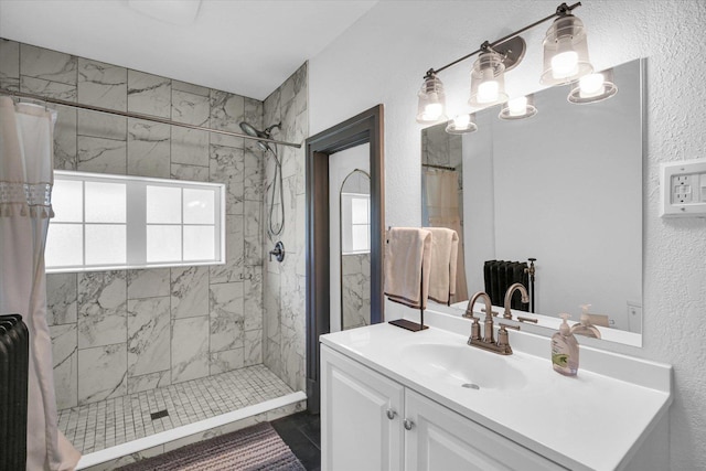 310 Davidson Dr, Champaign, IL 61821 - bathroom with vanity, a tile shower, and a textured wall