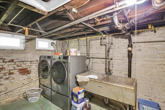 310 Davidson Dr, Champaign, IL 61821 - below grade area featuring washer and dryer and a sink