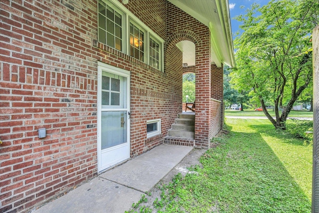 310 Davidson Dr, Champaign, IL 61821 - entrance to property featuring brick siding and a yard