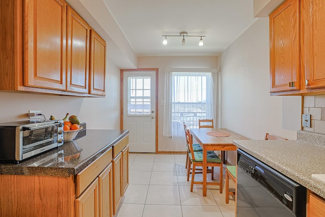 4925 N Harlem Ave Unit 3, Chicago, IL 60656 - kitchen with dishwashing machine, light tile patterned flooring, dark stone counters, and brown cabinets