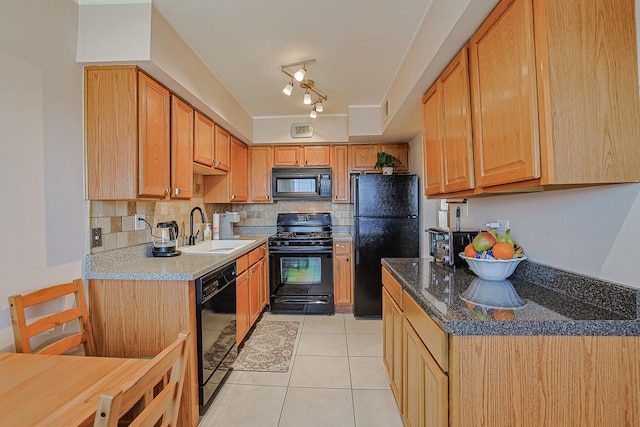 4925 N Harlem Ave Unit 3, Chicago, IL 60656 - kitchen featuring black appliances, a sink, decorative backsplash, and light tile patterned floors