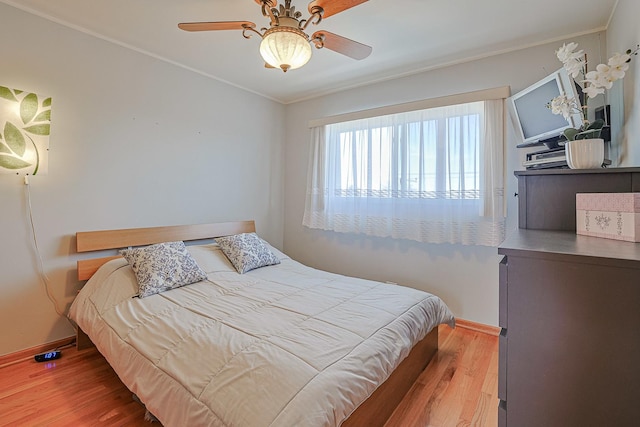 4925 N Harlem Ave Unit 3, Chicago, IL 60656 - bedroom with baseboards, wood finished floors, crown molding, and a ceiling fan