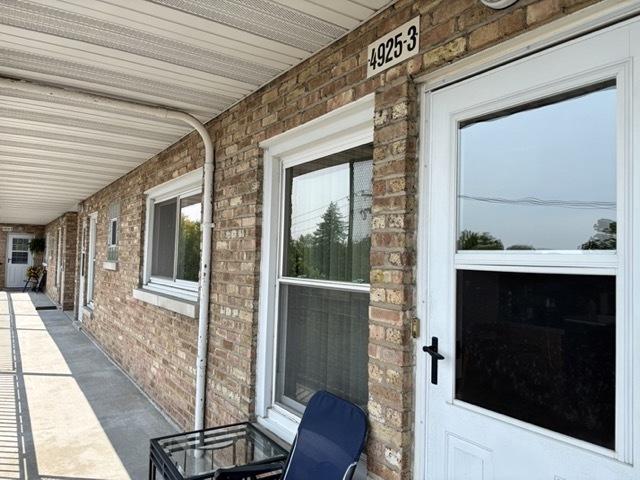 4925 N Harlem Ave Unit 3, Chicago, IL 60656 - entrance to property featuring brick siding and a porch