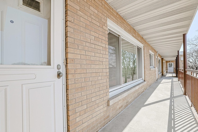 4925 N Harlem Ave Unit 3, Chicago, IL 60656 - view of exterior entry featuring brick siding and a porch