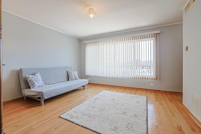 4925 N Harlem Ave Unit 3, Chicago, IL 60656 - living area featuring ornamental molding, baseboards, and wood finished floors