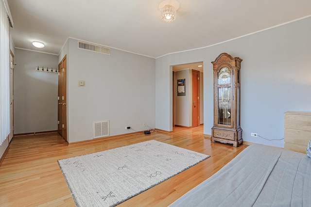 4925 N Harlem Ave Unit 3, Chicago, IL 60656 - bedroom featuring crown molding, light wood finished floors, and baseboards