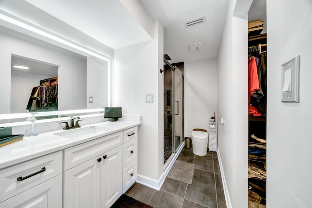 15704 Orlan Brook Dr Unit 163, Orland Park, IL 60462 - bathroom featuring a spacious closet, vanity, a stall shower, and baseboards