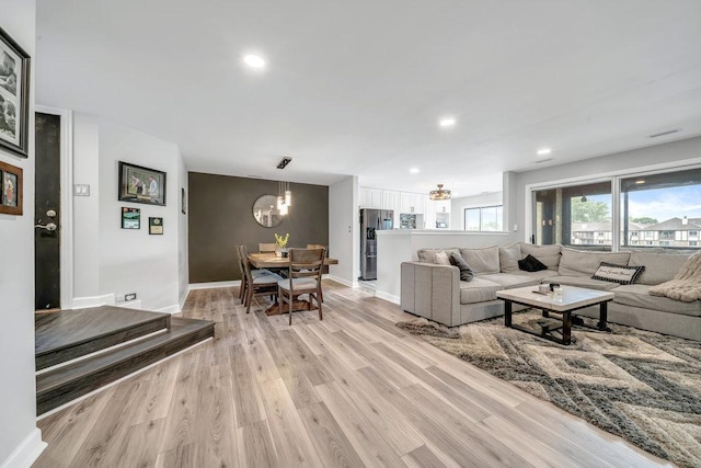 15704 Orlan Brook Dr Unit 163, Orland Park, IL 60462 - living area with a chandelier, light wood-style flooring, recessed lighting, and baseboards