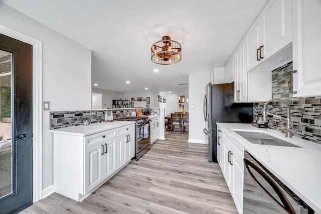 15704 Orlan Brook Dr Unit 163, Orland Park, IL 60462 - kitchen with gas stove, dishwasher, a sink, decorative backsplash, and white cabinets