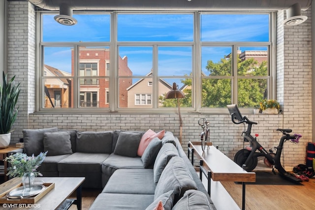 2750 N Wayne Ave Unit G, Chicago, IL 60614 - living area featuring brick wall, wood finished floors, and plenty of natural light