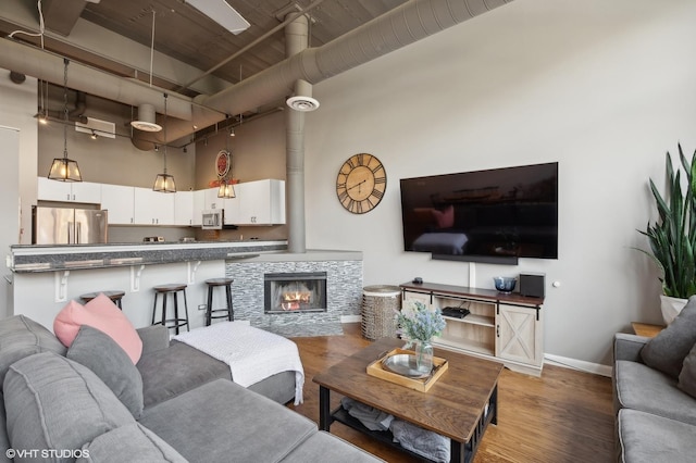 2750 N Wayne Ave Unit G, Chicago, IL 60614 - living room with wood finished floors, a towering ceiling, and baseboards