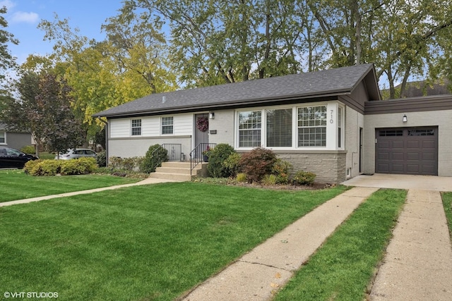 710 Western Ave, Glen Ellyn, IL 60137 - view of front facade with brick siding, driveway, a front lawn, and a garage