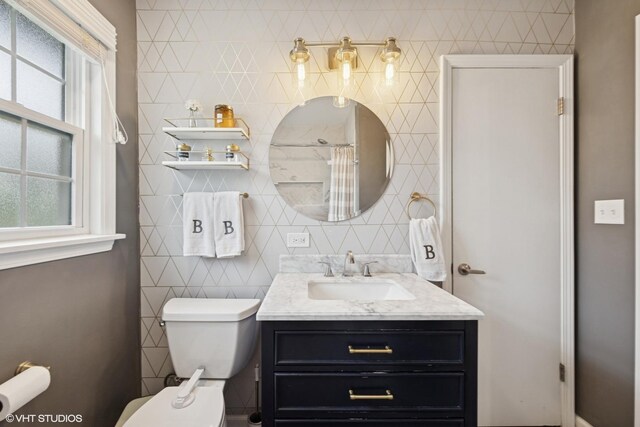 710 Western Ave, Glen Ellyn, IL 60137 - full bathroom with plenty of natural light, vanity, tile walls, toilet, and a shower with curtain