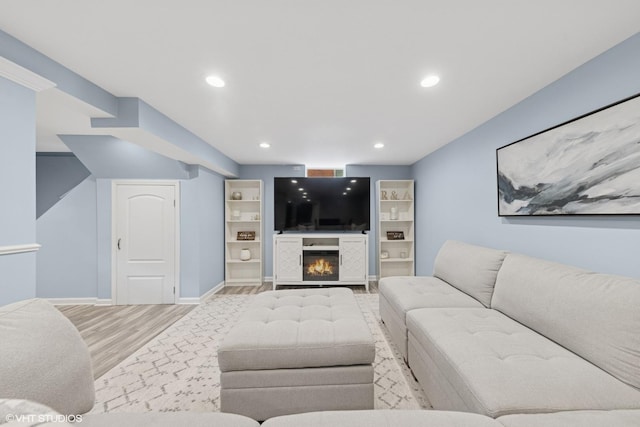 710 Western Ave, Glen Ellyn, IL 60137 - living area featuring light wood finished floors, baseboards, a warm lit fireplace, and recessed lighting