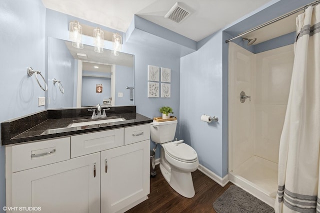 710 Western Ave, Glen Ellyn, IL 60137 - full bath with wood finished floors, toilet, a shower with shower curtain, and vanity
