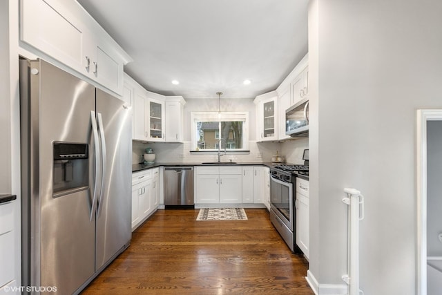 710 Western Ave, Glen Ellyn, IL 60137 - kitchen with appliances with stainless steel finishes, a sink, dark countertops, white cabinets, and recessed lighting