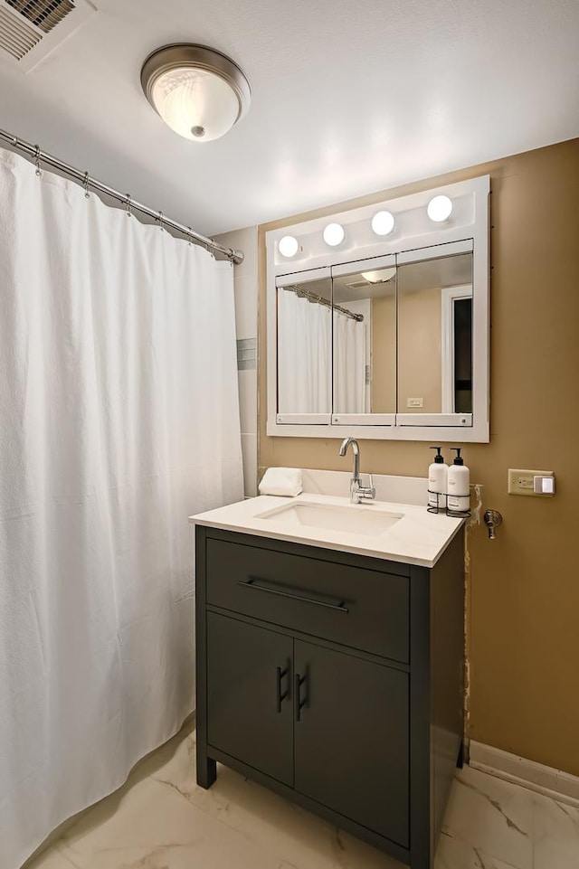 1640 Royal Oak Rd Unit 4, Darien, IL 60561 - bathroom featuring marble look tile flooring, vanity, baseboards, and a shower with curtain