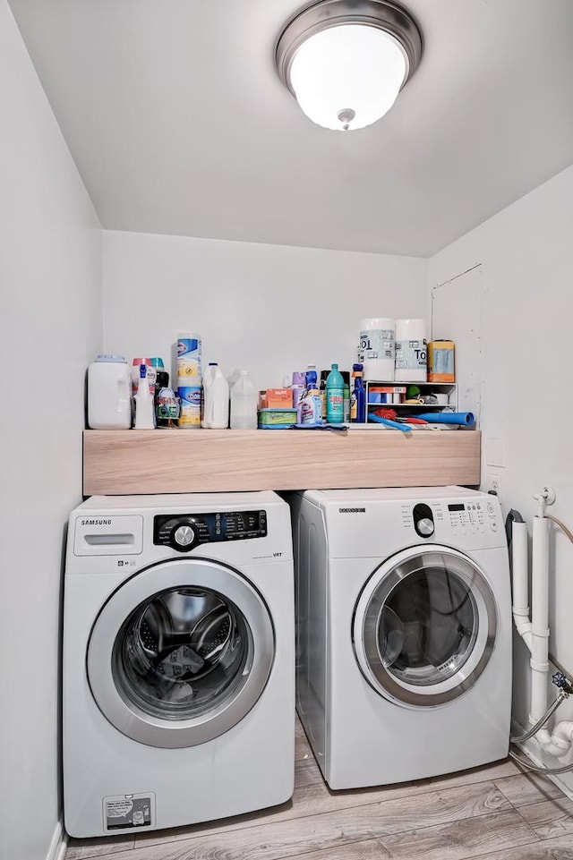 1640 Royal Oak Rd Unit 4, Darien, IL 60561 - laundry area with washing machine and dryer and light wood-style flooring