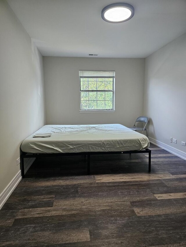 78 N Victoria Ln Unit F, Streamwood, IL 60107 - bedroom featuring baseboards